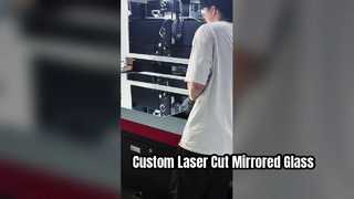 Custom laser-cut patterns on 1.4-meter-long mirrored glass